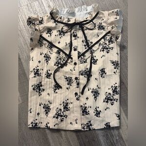 Ruffled Sleeveless Blouse